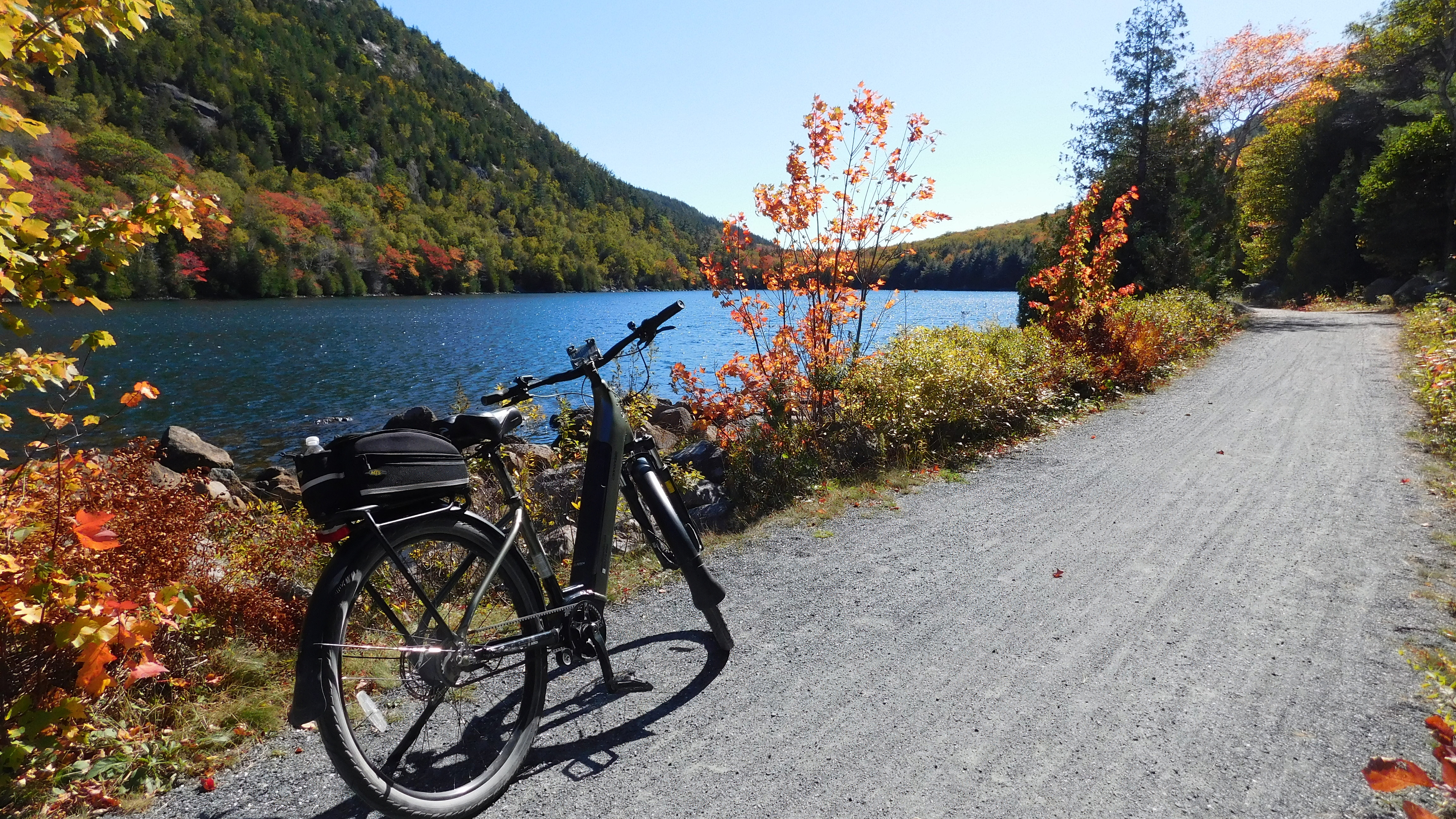 E-biking on Acadia carriage road near Bubble Pond with mountain views